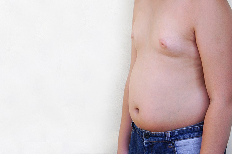 what causes belly fat in males
