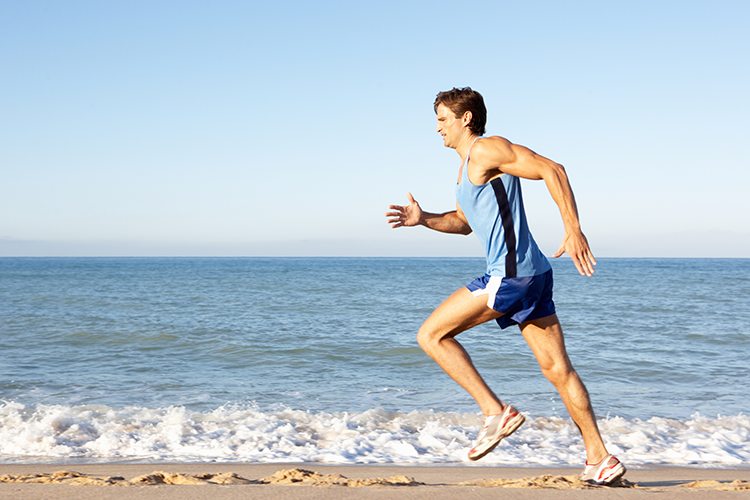 man running near a beach weight lifting exercises 