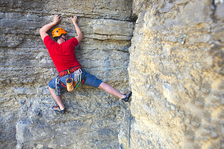 A man wear helmet for rock climbing